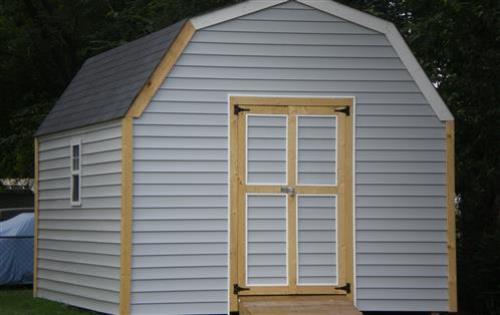 Shed 12x14 with white vinyl siding